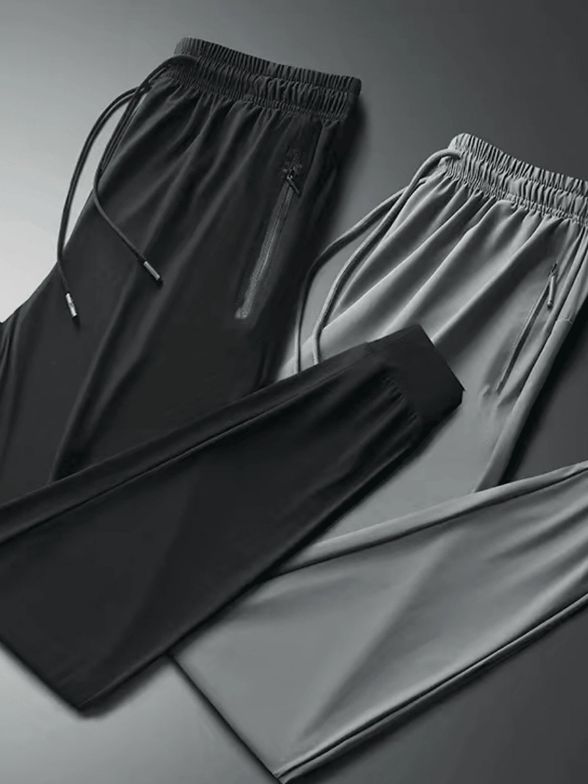 Kit 2 Calças Esportivas Jogger Flaneladas com Bolsos Laterais e Zíper - Preta e Cinza
